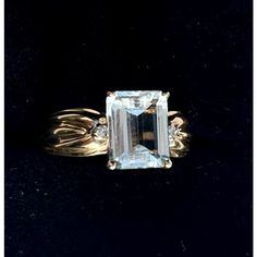 This is part of Chairish’s Fine Jewelry assortment.  DESIGNER CLYDE DUNEIER, Aquamarine & Diamond 14k Yellow Gold 2.7 Carat Ring. Ring Size: 6.5 in.  Stamped 14K, set with pale colored aquamarine. Weight of Ring: 4.9 grams Exquisite Formal Gemstones With Prong Setting, Exquisite Gemstones With Prong Setting For Formal Occasions, Classic Diamond Gemstone With Center Stone, Formal Diamond Ring With Gemstone And Baguette Cut, Luxury Topaz Baguette Cut Ring For Formal Occasions, Elegant Emerald Cut Gemstones For Formal Occasions, Luxury Formal Baguette-cut Topaz Ring, Luxury Formal Baguette Cut Topaz Ring, Formal Sapphire Ring With Center Stone And Baguette Cut