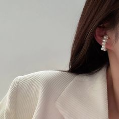 Elevate your style with our Faux Pearl No Pierce French Ear Cuff! This elegant accessory adds a touch of sophistication to any outfit without the pain of piercings. The faux pearls add a hint of luxury, making this the perfect accessory choice for any occasion. Upgrade your look today with our French Ear Cuff. Comes in a set of 2. Trendy White Pearl Earrings For Formal Occasions, Trendy Pearl Earrings For Pierced Ears, Trendy Silver Pearl Earrings For Wedding, Elegant White Ear Cuff As Gift, Elegant White Ear Cuff For Gift, Trendy Pearl Drop Earrings, Elegant Formal Ear Cuff, Elegant Pearl Ear Cuff Single Earring, Elegant White Ear Cuff With Pearl Drop