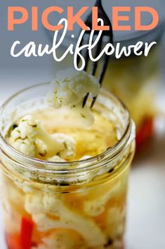 pickled cauliflower in a jar with a spoon