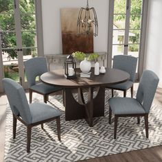 a dining room table with chairs around it