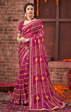 This Saree is Ready to Wear (With Fall and Pico Done). A designer saree in Magenta & Golden color. It has intricate design all over the saree. This saree is a suitable amalgamation of style and grace that is required from an ethnic wear. The saree is ideal for any formal gathering. The saree comes with an unstitched blouse of corresponding color and design as shown in the picture. Georgette Designer Magenta & Golden Color Saree Fabric Type: GeorgettePrimary Color: MagentaSecondary Color(s): - GoldenSaree Length: 6.0 meters including 0.8 meter blouseBlouse Material: Matching Georgette (Same as picture)Washing Instructions: Dry Clean Only