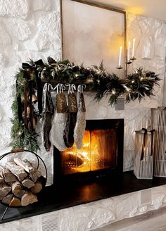 a fireplace with stockings hanging from it's mantle