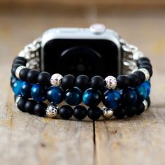 Stretch Black Apple Watch Band Upgrade your watch with our Apple watch bracelet! Refresh your smartwatch with our unique beaded strap. Our smartwatch band is beautifully handcrafted using high-quality natural black onyx and blue tiger eye stones loomed on a stretch band. It comes in 2 different sizes Our black strap is the perfect gift for yourself, the independent, or the free-spirited. And of course, get the benefits of the natural stones while wearing these trendy beaded watch bands: Black On Blue Tiger Eye Stone, Handmade Watch Bands, Beaded Watches, Apple Watch Bracelets, Apple Watch Sizes, Bracelet Apple Watch, Blue Onyx, Blue Tiger, Blue Tigers