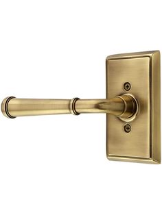 an antique brass door handle on a white background