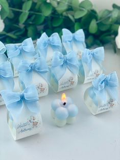 small blue candles with bows on them