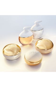 What it is: A shimmering body scrub that illuminates skin with pearlescent pigments and 24k-gold particles, and perfumes skin with the notes of J'adore.What it does: Apply the scrub in a moment of sensory indulgence. The texture transforms into a milky oil, releasing notes of J'adore, the iconic Dior perfume for women. The exfoliator is infused with cotton extract and golden shimmer for soft, illuminated skin. The scent of the fragrance will linger all day.Notes:- Top: pearlescent pigments, gold particles- Middle: jasmine extracts- Base: cotton extracts Made in France Dior Natural Glow Set, Dior Jadore, Makeup Package, Dior Perfume, Body Gel, Hydrating Cream, Floral Notes, Floral Scent, Body Moisturizer