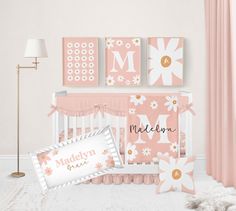 a baby's room with pink and white decor