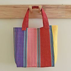 Child sized tote bag is ready to fill with things for the beach, the drive to the zoo, or the farmer's market with mom. Handwoven 100% cotton in bright multicolor stripes in red, pink, yellow and blue. 9" High x 7.5" Wide x 3.5" deep with 2 straps that have a 5.5" drop. Washable and dryable! Things For The Beach, Model Sailboat, Mini Market, Striped Bags, With Mom, Market Tote, Cooler Bag, Basket Bag, Farmer's Market