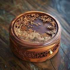 a wooden box with carvings on it sitting on a table