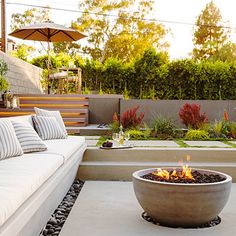 a fire pit in the middle of a patio