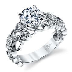 a white gold engagement ring with an intricate design