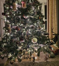 a christmas tree is decorated with ornaments and lights