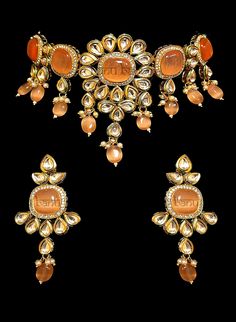 "Best Seller! Nayana - Modern Bride Kundan Bridal Set with Orange Onyx stone  Indian bridal set makes every bride's outfit perfect. This clear Kundan is further accented with orange Onyx gems making it one of a kind. Beautiful gemstone drops adorn this set.  This jewelry set is sure to make you stand out from the crowd. This necklace set comes along with a beautiful pair of Jhumka earrings with Kundan and Orange Onyx to match. Our Bridal collection is handmade with love & care. It makes us super Orange Temple Jewelry For Gifts, Orange Temple Jewelry As A Gift, Traditional Orange Gemstone Jewelry, Orange Temple Jewelry Gift, Elegant Orange Ceremonial Jewelry, Traditional Orange Jewelry For Diwali, Orange Gemstone Jewelry For Wedding, Orange Jewelry For Wedding And Festivals, Festive Orange Jewelry For Gift