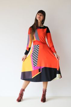 AMBER midi DRESS  The original abstract print design on the dress is created by a professional artist. Colourful abstract print dress with geometrical elements, with long sleeves. Be unique. Be outstanding. Be authentic. Bright and lively colors have the power to uplift mood and instill a sense of joy. Wearing a vibrant color dress can evoke feelings of happiness and positivity, brightening not only the wearer's day but also those around her. The dress showcases an original abstract print design Patterned Midi Dress For Party, Chic Long Sleeve Graphic Print Dresses, Chic Long Sleeve Dresses With Graphic Print, Long Sleeve Multicolor Dress With Geometric Pattern, Multicolor Long Sleeve Dress With Geometric Pattern, Vibrant Multicolor Abstract Print Dress, Chic Multicolor A-line Midi Dress, Long Sleeve Dresses With Abstract Print, Colorful Long Sleeve Dress For Fall