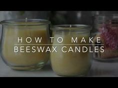 two candles sitting next to each other with the words how to make beeswax candles