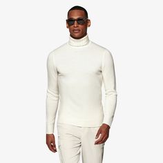 A classic style in a luxurious cashmere blend, this off-white turtleneck sweater is a richly structured and elegantly simple addition to your winter wardrobe whether it's on its own or under a tailored jacket. White Turtleneck For Workwear In Winter, White Formal Sweater For Winter, Fitted Cashmere Sweater For Formal Occasions, Classic Fitted Cashmere Turtleneck, Formal Fitted Solid Color Sweater, Fitted Classic Winter White Sweater, Elegant Winter White Sweater For Work, Classic Fitted Winter White Sweater, Classic Fitted Turtleneck For Work