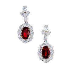 A pair of dangle earrings featuring 8.06 carats of oval shaped red rubies and 7.42 carats of oval shaped diamonds, set in 18 karat two tone gold. Luxury Ruby Jeweled Necklaces, Ruby Jewelry Earrings, Luxury Ruby Diamond Necklace With Accents, Ruby And Diamond Necklace 1stdibs, Luxury Red Ruby Diamond Necklace, Luxury Exquisite Emerald Necklace, Red Ruby Earrings, Diamonds Direct, Diamond Rings With Price