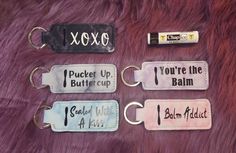 four keychains that say you're the balm and i do not know what they are