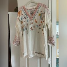 Beautiful Embroidered Linen Top By Johnny Was. Size Is Xs However Their Linens Run Large. Bust Lying Flat Pit To Pit Is 23-1/2. Fits More Like A Small To Medium. New With Tags Casual V-neck Embroidered Top With Multicolor Embroidery, Relaxed Fit V-neck Embroidered Top With Floral Embroidery, Relaxed Fit V-neck Top With Floral Embroidery, Multicolor Embroidered V-neck Top For Vacation, Spring Embroidered V-neck Top With Relaxed Fit, V-neck Embroidered Top For Spring With Relaxed Fit, Multicolor Embroidered Cotton V-neck Top, Multicolor Long Sleeve Embroidered Top For Spring, Multicolor Embroidered Long Sleeve Top For Spring