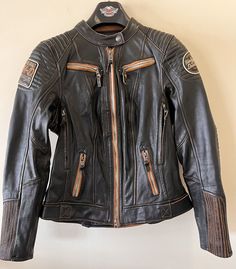 Women's Maize Leather Jacket Black - Liner - New With Tags Harley Davidson   Size Small Condition: Liner removed only to try on jacket. Tags attached to liner. Up for sale is a really nice jacket recently acquired from a private collection in North Carolina.  All of the pieces from this collection are in great condition.  If the item is new with tags, it will be noted in the title, so please see all of the pictures posted for general condition. All of my pre-owned clothing items are washed and inspected for any defects or damage.  I am not perfect and do occasionally miss something, but I will refund any item the buyer discovers to have damage not noted. NO STOCK PHOTOS.....the item pictured is the actual item for sale. Items will be packaged securely in an clear polybag placed inside of a 90s Motorcycle Outfit, Motorcycle Jacket Aesthetic, Harley Davidson Outfits Woman, Biker Outfits For Women, 80s Leather Jacket, Leather Jacket Patches, Combat Jacket, I Am Not Perfect, Custom Leather Jackets