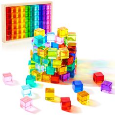 PRICES MAY VARY. What You Will Get: you will receive 60 pieces of rainbow crystal cubes, and they are packed in a safe solid wood storage box; Our rainbow crystal cubes are available in 10 colors, very beautiful and charming, and they will sparkle under the sun and show different colors reflection Beautiful Teaching Aids and Toys: rainbow acrylic cubes are in bright and vibrant colors; When exposed to light, they glow brilliantly, creating a brilliant visual effect; When paired with a light tabl