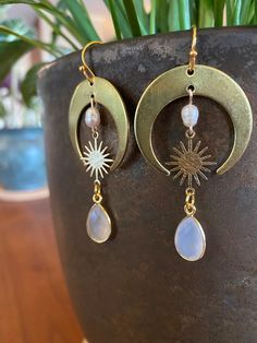 Handmade sun and moonstone earrings. ✨Made with love and intention✨ Hypoallergenic 18k gold plated sterling silver. FOLLOW: Insta: @alchemistreasure ✨P R O D U C T I O N - T I M E ✨ Each pair of my lovingly handcrafted earrings is naturally one of a kind and hand made to order. Please allow 2-4 business days for production. If you have a specific deadline, please let me know and I will do my best to accommodate you! ✨N A T U R A L - V A R I A T I O N ✨ Please note, these stones are real, raw, an Elegant Hypoallergenic Moon-shaped Jewelry, Crescent Moonstone Gold Jewelry, Elegant Hypoallergenic Moon Shaped Jewelry, Everyday Nickel Free Moonstone Jewelry, Hypoallergenic Gold Moonstone Jewelry, Elegant Brass Earrings With Moon Charm, Gold Moonstone Jewelry With Moon Phase, Celestial Drop Earrings For Everyday, Everyday Celestial Drop Earrings