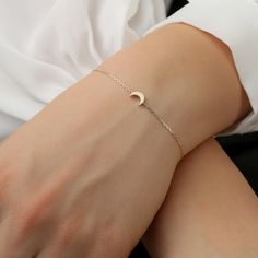 14K Gold Mini Moon Bracelet / Crescent Gold Necklace / Minimal Plain Gol Moon / Daint Moon Bracelet / Valentines Gift / From Sarah Elise ✔ Handmade ✔ Solid Gold ✔ Size of Moon: 7 x 5 mm ✔ The thickness of the Moon: 2 mm Small and sweet, this mini-moon Bracelet can be worn alone for a minimalist look. The moon is not flat but has a thickness to it for a more solid look. Put it on, make a wish, and remember to always shoot for the stars. Available 14K Solid White, Solid Yellow, Solid Rose Gold Wor Elegant Adjustable Crescent Jewelry, Elegant Adjustable Crescent Shaped Jewelry, Minimalist Moon-shaped Adjustable Jewelry, Elegant Rose Gold Moon Phase Jewelry, Elegant Adjustable Jewelry With Moon Charm, Minimalist Adjustable Moon-shaped Jewelry, 14k Gold Jewelry With Moon Charm, Elegant 14k Gold Jewelry With Moon Charm, Elegant Everyday Moon Phase Jewelry