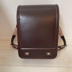 Randoseru : This randoseru made by Tsuchiya Bag company Which is one of the best randoseru maker in Japan. Its made by high quality Cowhide.  Item: Cowhide Leather school Bag / Japanese Randoseru No. rnd016 Brown / Pink Condition: Used/ Very Good. Please check the listing pictures. Size: Adult Wearable You could put your laptop without any ploblem. Tsuchiya Bag Company / Made in Japan Tsuchiya bag is one of the best randoseru maker in Japan. https://fujiyamarock.etsy.com Shipping Japan Post take Rectangular Laptop Bag For Students, Portable Leather Backpack For Everyday Use, Rectangular Brown Student Bag, Rectangular School Satchel, Rectangular Brown Shoulder Bag For School, Brown Rectangular Shoulder Bag For School, Rectangular Student Backpack, Portable Leather Backpack For Daily Use, Brown Portable Backpack For School