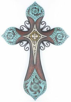 an ornate wooden cross with blue and brown designs