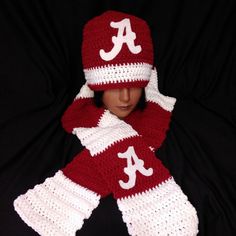 Roll Tide If you are an Alabama fan or you know an Alabama fan, this will be the perfect gift for them. I have a crimson, white, black hat or gray and white hat and a crimson and white scarf. Please let me know which scarf you would prefer. I have all three. My scarves are made of 100% acrylic yarn. It's just right to make your neck warm for the cold weather. I am selling scarves on this page but I can make a matching hat upon request at an additional cost. If you would like a different school please let me know in the personalization space. Alabama Fans, Hand Knit Blanket, Scarf And Hat, Cute Beanies, White Scarf, White Scarves, White Hat, Roll Tide, Crochet Hat Pattern