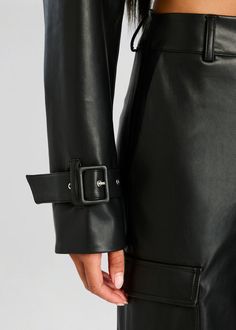 Cropped vegan leather jacket with adjustable buckle cuffs. Shown here in Black. Face: 100% Polyurethane Back: 100% Polyester Made in China Model is 5'10" wearing size S Style No. 4434-19 Jumpsuit And Blazer, Denim Sweater, Vegan Leather Jacket, Rehearsal Dress, Clothing Essentials, Sweater Sale, Romper Dress, Jacket Sale, Made In China