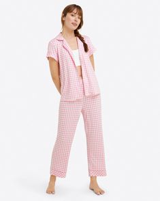 Sleep time never looked so chic. The Linda Pajama Set in Gingham is as comfortable as it is pretty. Constructed from a lush luxe knit, this fabric feels ultra soft and buttery to the touch. Designed with a relaxed fit, this two-piece set features a vibrant pink gingham print, functional buttons, and a stretchy elastic Gingham Fashion, Sleep Time, How To Dress A Bed, Spandex Top, Draper James, Pink Gingham, Mini Dress Casual, Gingham Print, Skirts For Sale