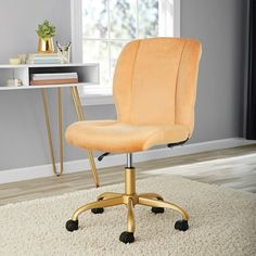 an office chair with wheels in front of a desk and rug on top of the floor