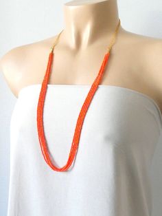 "Delicate and dainty long beaded orange necklace. It measures 30\". ❤ SHIPPING Please check shipping options and timeframe once you add item/s to the cart. In addition, you can click on the tab \"Shipping & Policies\" above for more information on processing time and cost. ❤ CUSTOM ORDERS If you like this item in a different color, send me a message indicating: color, size and quantity needed. I will send you a link for a \"custom order\" and you'll be able to place the order there. If you l Bohemian Orange Necklace For Wedding, Orange Multi-strand Colorful Beads Jewelry, Orange Beaded Long Necklace, Orange Multi-strand Beaded Necklaces, Multi-strand Orange Necklaces For Gifts, Handmade Multi-strand Orange Beaded Necklaces, Orange Multi-strand Necklaces For Gifts, Orange Multi-strand Beaded Necklace, Handmade Orange Beaded Necklace For Wedding