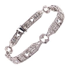 Vintage 1930's Art Deco Platinum Diamond Bracelet 3.00ct | See more rare vintage Retro Bracelets at https://www.1stdibs.com/jewelry/bracelets/retro-bracelets Vintage White Gold Hand-set Bracelets, Vintage White Gold Diamond Bracelet With Brilliant Cut, Vintage Diamond Bracelet With Hand-set Diamonds, Vintage Platinum Tennis Bracelet For Anniversary, Art Deco White Gold Diamond Bracelet With Brilliant Cut, Vintage Hand Set Diamond Bracelet, Art Deco Platinum Diamond Bracelet, Art Deco Diamond Bracelets For Anniversary, Art Deco Diamond Bracelet In White Gold