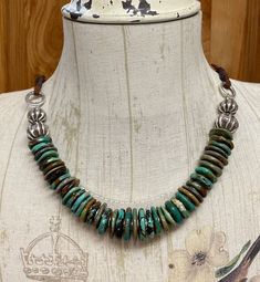 "* Welcome to FoxSparrowOOAKDesign! * This listing is for one turquoise and Karen Hill Tribe necklace handcrafted by me in my smoke free home studio. * Hubei Turquoise. * Beautiful shades of greens and browns. * The beads are graduated from 15mm to 20mm. * Karen Hill Tribe silver findings. * Substantial length of 25\". * The center section measures 10\". * Secured with soft leather ties and a hand forged hook clasp. * Ready to ship and securely bubble wrapped. * Thank you for supporting handmade Adjustable Green Rustic Necklace, Adjustable Rustic Green Necklace, Rustic Green Adjustable Jewelry, Artisan Green Turquoise Necklace With Patina, Unique Southwestern Green Necklace, One Of A Kind Southwestern Green Necklace, Southwestern Green Necklace, Artisan Brown Turquoise Necklace For Jewelry Making, Adjustable Southwestern Green Turquoise Necklace