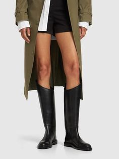 25mm leather riding boots - Jil Sander - Women | Luisaviaroma Jil Sanders, Black Riding Boots, Leather Riding Boots, Flat Espadrilles, Jeans Jumpsuit, Swim Accessories, Heeled Loafers, Shearling Jacket, Ski Wear