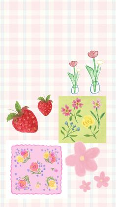 some flowers and strawberries on a checkered table cloth