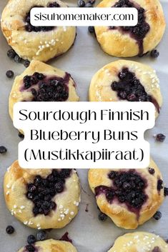 blueberry danish muffins on a baking sheet with the words sourdough finnish blueberry buns