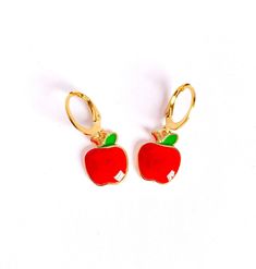 Rosy red apple earrings that would make a really cute end of term gift for a teacher!  🍎 Item Details 🍎 - Red Enamel Apple Charms with green leaf  - Gold tone huggie hoops  - Latchback fastening for security - Approximate drop of 1" (25mm) - Apple charm measures approximately 0.5" (12mm) wide - Arrive beautifully packaged  ✨Shipping✨   * We ship next business day via Royal Mail 1st Class within the U.K. and via Royal Mail International Standard for international orders (unless stated otherwise Snow White Cosplay, Apple Earrings, Fruit Earrings, Food Jewelry, Gifts For Teachers, Enamel Charms, Green Leaf, Red Apple, Charm Jewelry