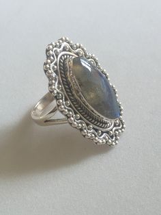 Natural Blue Labradorite Silver Ring 925 Solid Sterling Silver Gemstone Ring Hand Made Silver Ring Gemstone - Labradorite Ring Size - 7 US Ring Stone Size - 10x20 mm Ring Weight - 11 gram Stone Shape - Marquise Code - 007 Zodiac - Leo, Scorpio, Sagittarius Labradorite Ring is a useful companion through change, imparting strength and perseverance. It balances and protects the aura, raises consciousness and grounds spiritual energies. Delivery time frames (from date of shipping) - USA: ~2 weeks - Silver Turquoise Gemstone Ring For Weddings, Labradorite Rings Stamped 925 For Anniversary, Oval Labradorite Wedding Jewelry, Anniversary Labradorite Rings Stamped 925, Silver Labradorite Rings For Anniversary, Silver Labradorite Jewelry For Wedding, Silver Turquoise Wedding Ring With Gemstone, Oval Labradorite Ring Stamped 925, Silver Labradorite Ring Stamped 925