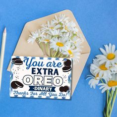 there are daisies next to an envelope with the words you are extra oreo on it