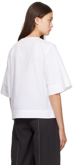 Organic cotton poplin blouse. · Crewneck · Keyhole cutouts at four-button closure · Darts at chest Supplier color: Bright white White Poplin Shirt For Spring, Casual Poplin Tops For Office, Poplin Short Sleeve Workwear Blouse, Short Sleeve Poplin Blouse For Work, Modern Cotton Top For Office, Casual White Poplin Tops, Modern Cotton Office Top, White Button-up Poplin Blouse, Modern Poplin Tops For Spring