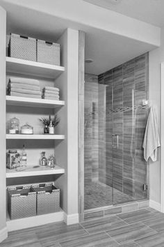 a walk in shower sitting inside of a bathroom