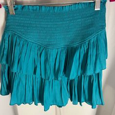 Never Worn Boutique Skirt!! Chic Flowy Tiered Skirt, Chic Tiered Bottoms For Day Out, Blue Ruffled Stretch Skort, Blue Stretch Ruffle Skort, Chic Blue Tiered Skirt, Spring Stretch Tiered Skirt, Spring Tiered Stretch Skirt, Chic Tiered Bottoms For Vacation, Chic Blue Tiered Bottoms