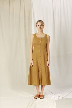 FOR THIS ITEM, WE NEED YOUR " BUST, WAIST, HIPS AND HEIGHT " MEASUREMENTS SO WE CAN TAILOR THE DRESS TO FIT YOU BEST. HANDMADE ITEAM - perfect French seam - The model is 1m69 tall and wearing size S and Hazel Color ■ fit - SLEEVELESS LINEN DRESS WITH BUTTON  - Has sleeveless, square neck and two pockets inside ■ Sizing details and color - Please choose sizes carefully as we provided a very detailed sizing guide. - If you're not sure with sizing you can send us your information you want to get he Brown Summer Dresses With Buttons, Brown Buttoned Summer Dresses, Square Neck Midi Dress With Buttons For Daywear, Brown Button Closure Midi Dress For Summer, Brown Button-up Midi Dress For Summer, Brown Summer Midi Dress With Button Closure, Square Neck Day Dresses With Buttons, Square Neck Dresses With Buttons For Daywear, Brown Sleeveless Dress With Button Closure