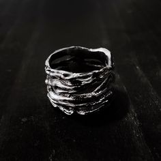 The Thicket Ring features a wrapped branch twig design in an infinite loop. The thicket ring is inspired by the dark woods of the black forest in southwest Germany.Ring is made of solid sterling silver (.925), oxidized to show detail. Due to the ring being rather tall, it is advised that you size up half a ring size from your normal size in order to properly fit this ring.The handmade nature of our items means that no two rings are exactly alike. All of our Jewelry at Remains is made to order an Dark Rings, Trio Necklace, Dark Woods, The Black Forest, Dark Jewelry, Rock Jewelry, Nature Inspired Jewelry, Matching Rings, Black Necklace