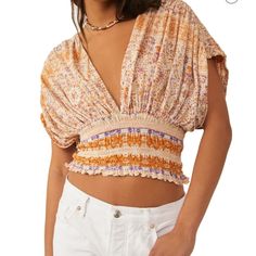 Fanciful Boho Dreams Feature Tops Just Like This, With Elastic Smocking That Emphasizes The Billowy Bodice With Alluringly Deep Front And Back V-Necklines. 17" Length (Size Medium) Ties At Back Deep V-Neck Elbow-Length Sleeves 62% Cotton, 38% Modal Machine Wash, Tumble Dry Bohemian V-neck Top With Smocked Back, Bohemian V-neck Tops With Smocked Back, V-neck Smocked Top With Smocked Bodice For Vacation, Bohemian V-neck Blouse With Smocked Back, V-neck Blouse With Smocked Bodice For Vacation, V-neck Blouse With Smocked Back For Vacation, Summer Purple Smocked Top With Smocked Bodice, V-neck Smocked Top For Vacation, Purple Smocked Top With Smocked Bodice For Summer