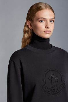 Crafted from the softest cotton jersey, this sweatshirt presents a contemporary take on femininity. The loose fit style is adorned with a crystal logo motif, in a nod to a collection inspired by the concept of light and glimmer. Luxury Logo Detail Sweatshirt For Winter, Designer Logo Print Tops For Winter, Designer Winter Tops With Logo Print, Luxury Tops With Logo Detail For Fall, Luxury Logo Tops For Fall, Designer Tops With Logo Print For Winter, Luxury Logo Detail Tops For Fall, Luxury Crew Neck Sweatshirt With Logo, Luxury Logo Detailed Crew Neck Sweatshirt