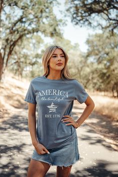 Blue Jean color "America the Beautiful" True to size Crewneck 100% cotton Relaxed Fit Washed Blue Cotton Tops, Blue Cotton Shirt For 4th Of July, 4th Of July Blue Cotton Shirt, Summer Washed Blue Cotton T-shirt, Washed Blue Cotton T-shirt With Relaxed Fit, Basic Washed Blue Cotton Tops, Graphic Cotton Tee For 4th Of July, Cotton Graphic Tee For 4th Of July, Casual Crew Neck Shirt Made In Usa